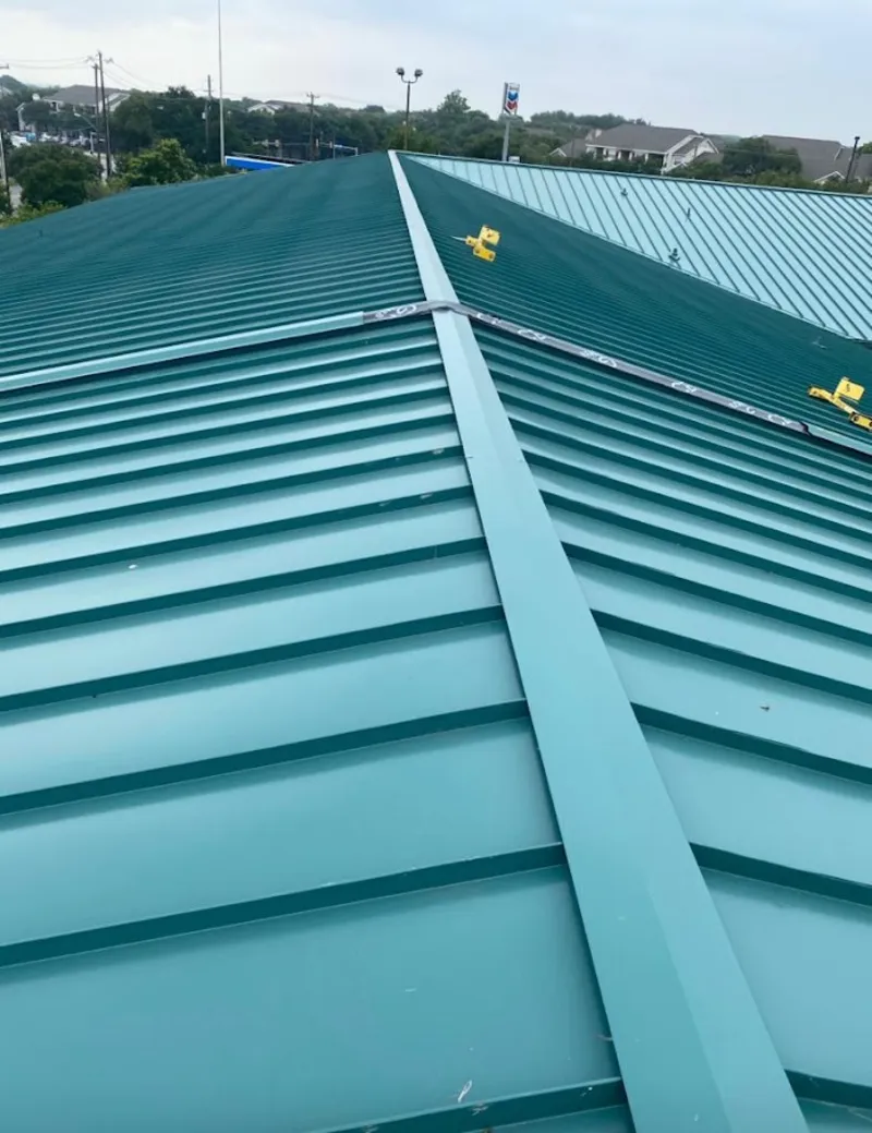 Green commercial metal roof ridge and valley for Metal Roof Repair in Algoma